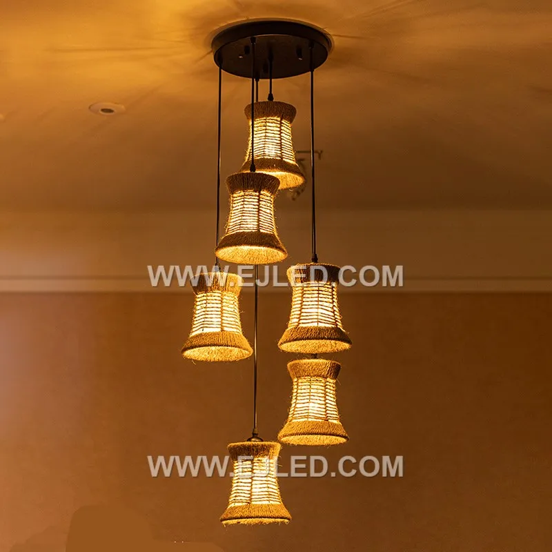 Bell-shaped, the RP0039 pendant is woven from natural rattan strips, creating a semi-open shade that allows light to filter through its texture. It holds a single lamp, directing light downwards. - view 6