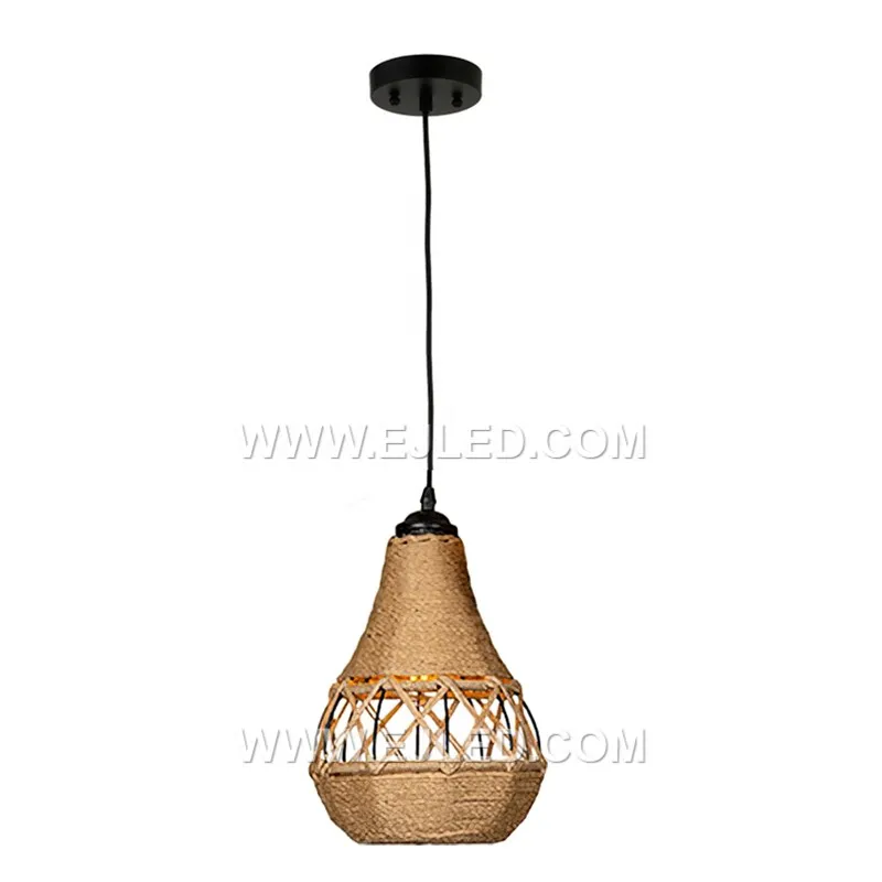 Woven from natural rattan, the RP0042 pendant light features three bell-shaped shades that direct light downwards while diffusing it through their open weave. It is designed for focused illumination over surfaces.