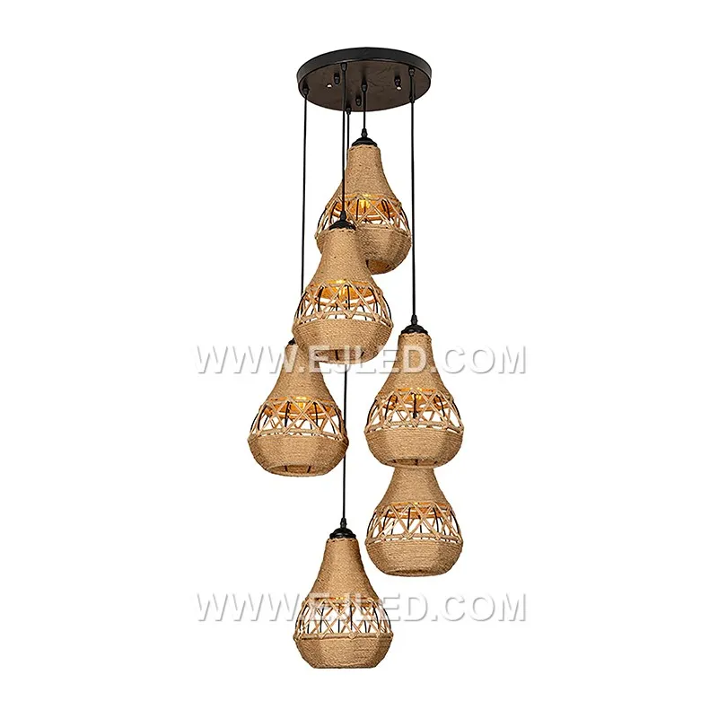 Woven from natural rattan, the RP0042 pendant light features three bell-shaped shades that direct light downwards while diffusing it through their open weave. It is designed for focused illumination over surfaces. - view 3
