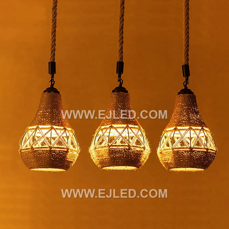 Woven from natural rattan, the RP0042 pendant light features three bell-shaped shades that direct light downwards while diffusing it through their open weave. It is designed for focused illumination over surfaces. - view 4