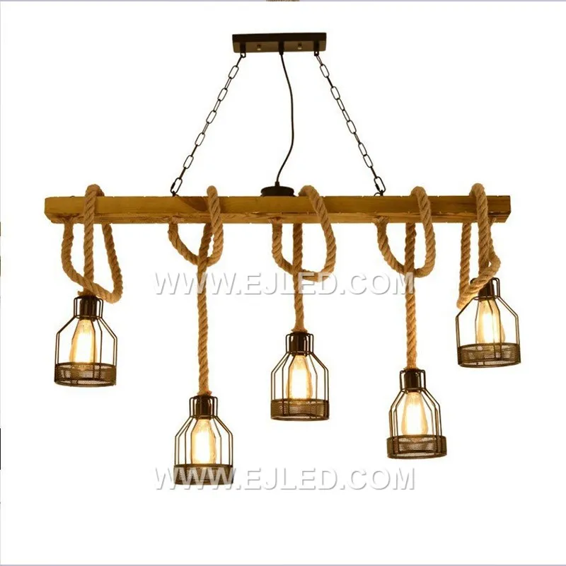 Natural hemp rope is tightly woven around a visible cylindrical wooden frame, forming an enclosed shade. This single-lamp pendant provides a warm, filtered glow, emphasizing natural textures and a rustic aesthetic. - view 2