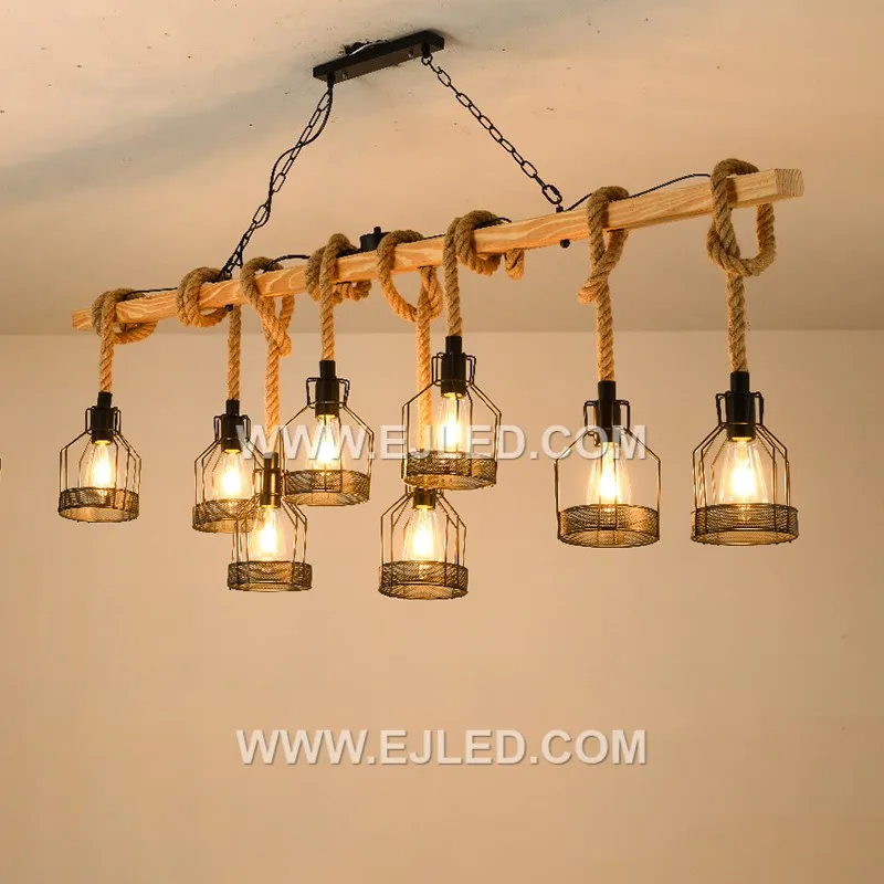 Natural hemp rope is tightly woven around a visible cylindrical wooden frame, forming an enclosed shade. This single-lamp pendant provides a warm, filtered glow, emphasizing natural textures and a rustic aesthetic. - view 5