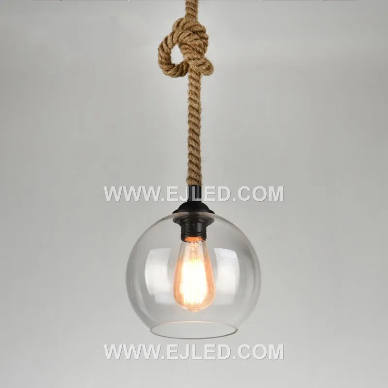 Clear glass forms a spherical shade for this single-lamp pendant, accented by a band of natural hemp rope. The visible bulb offers bright, omnidirectional light, suitable for smaller spaces or clustered arrangements. - view 2