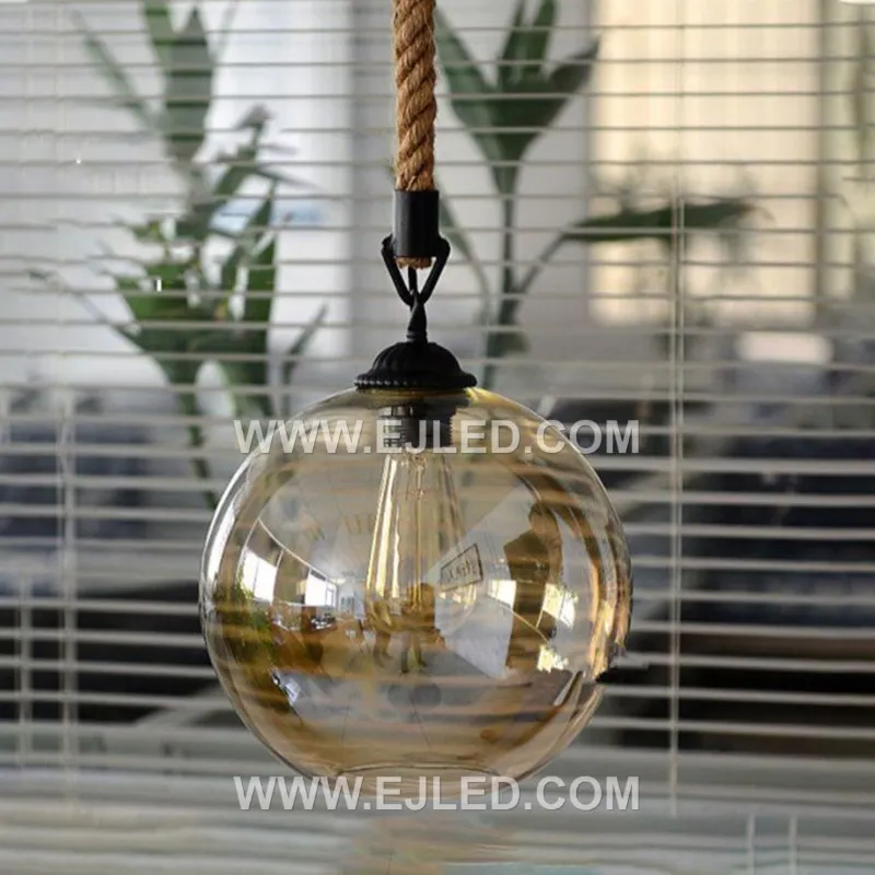Clear glass forms a spherical shade for this single-lamp pendant, accented by a band of natural hemp rope. The visible bulb offers bright, omnidirectional light, suitable for smaller spaces or clustered arrangements. - view 3