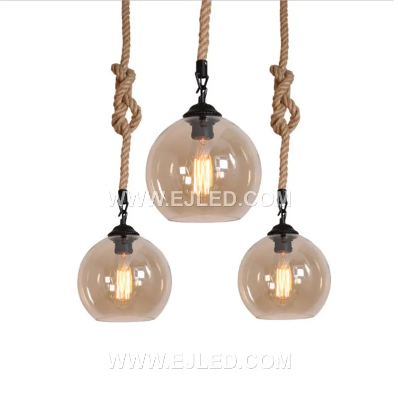 Clear glass forms a spherical shade for this single-lamp pendant, accented by a band of natural hemp rope. The visible bulb offers bright, omnidirectional light, suitable for smaller spaces or clustered arrangements. - view 4