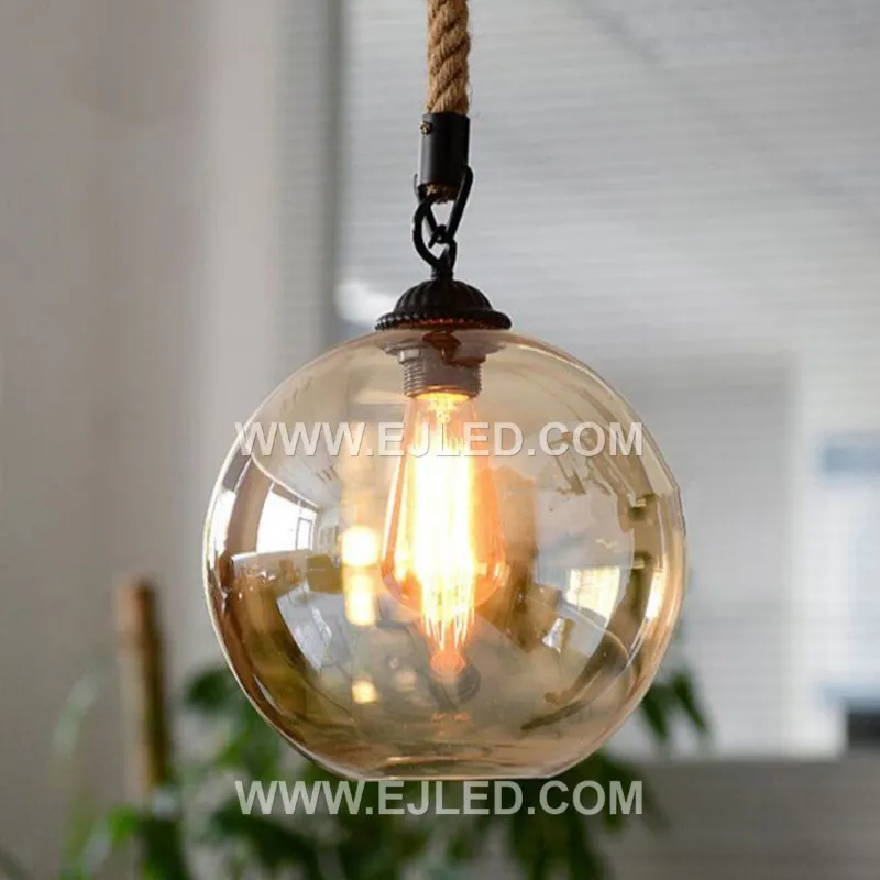 Clear glass forms a spherical shade for this single-lamp pendant, accented by a band of natural hemp rope. The visible bulb offers bright, omnidirectional light, suitable for smaller spaces or clustered arrangements. - view 5