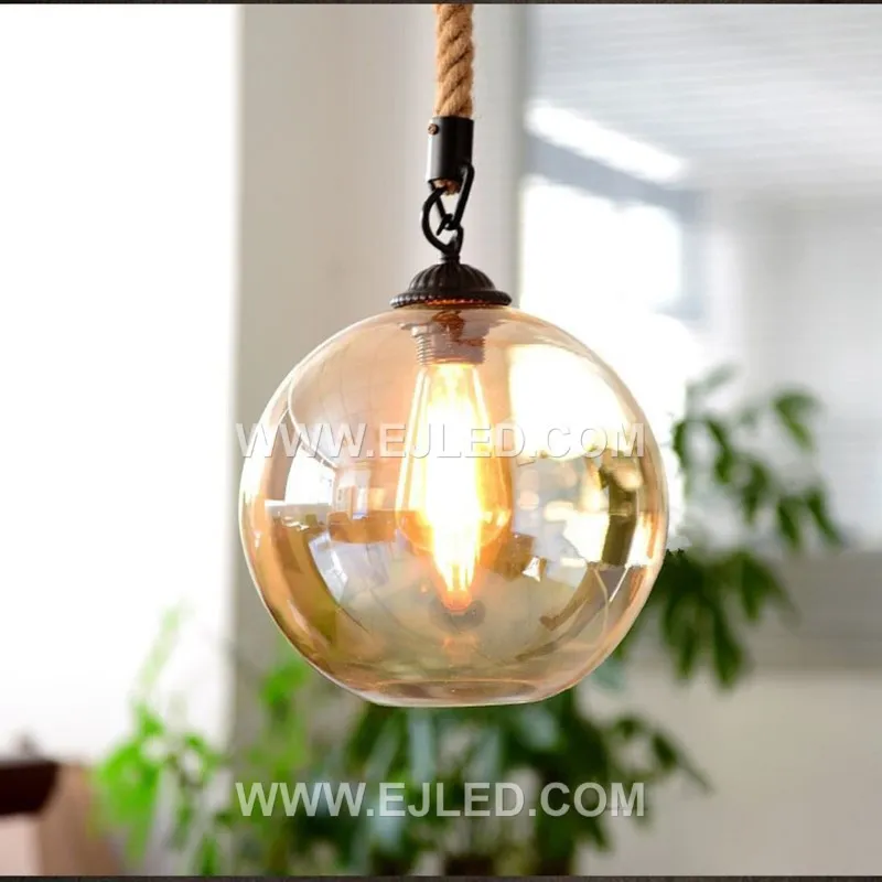 Clear glass forms a spherical shade for this single-lamp pendant, accented by a band of natural hemp rope. The visible bulb offers bright, omnidirectional light, suitable for smaller spaces or clustered arrangements. - view 6