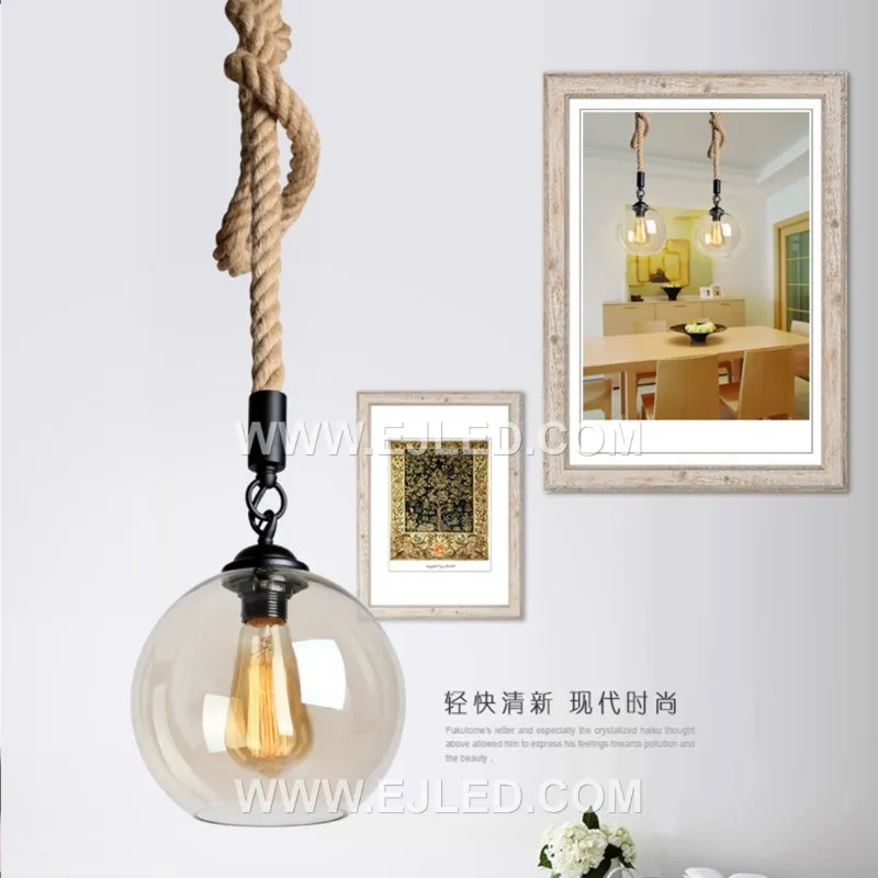 Clear glass forms a spherical shade for this single-lamp pendant, accented by a band of natural hemp rope. The visible bulb offers bright, omnidirectional light, suitable for smaller spaces or clustered arrangements. - view 7