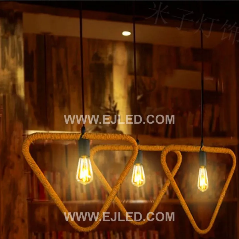 The RP0055 is a clear glass pendant light partially encased in a woven hemp rope, forming a distinctive triangular pattern. This fixture offers a rustic yet refined aesthetic, providing diffused light suitable for cafes, lounges, or accent lighting in homes. - view 6