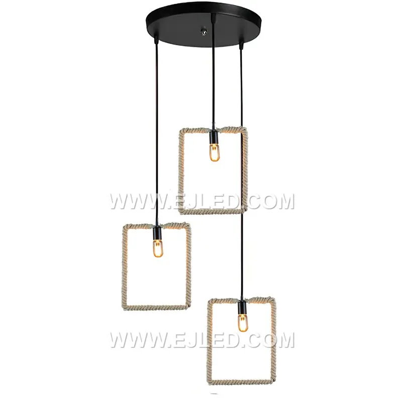 Natural hemp rope forms the cuboid shade of the RP0058 pendant, meticulously wrapped around a black metal frame. Its open structure allows for ambient light distribution, showcasing the bulb within a rustic yet defined form. - view 2