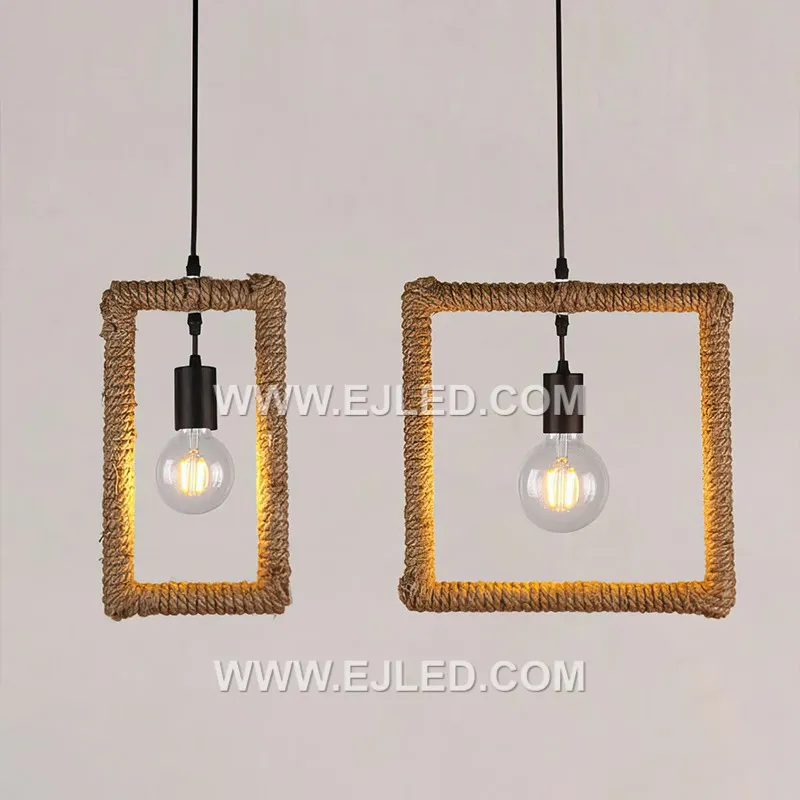 Natural hemp rope forms the cuboid shade of the RP0058 pendant, meticulously wrapped around a black metal frame. Its open structure allows for ambient light distribution, showcasing the bulb within a rustic yet defined form. - view 5