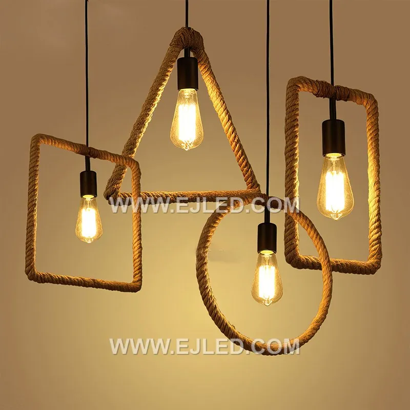 Natural hemp rope forms the cuboid shade of the RP0058 pendant, meticulously wrapped around a black metal frame. Its open structure allows for ambient light distribution, showcasing the bulb within a rustic yet defined form. - view 6