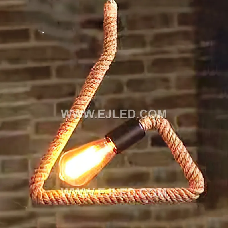The RP0059 pendant light introduces a distinctive cylindrical form to the hemp rope series, crafted from natural rope tightly wrapped around a black metal frame. Its open ends allow for broad light diffusion. - view 2