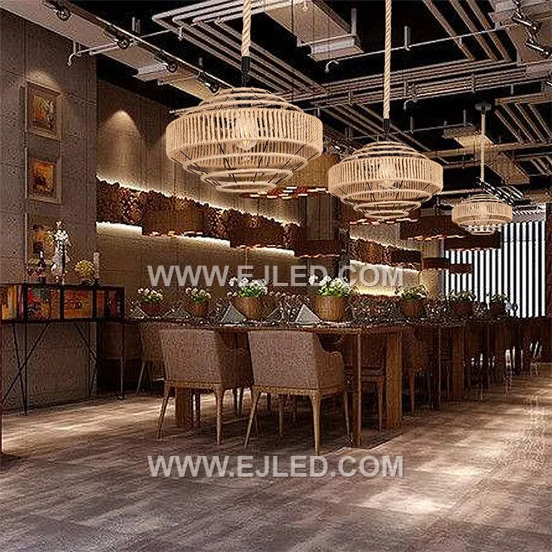 Tightly woven natural rattan forms the wide, drum-shaped shade of the RP0077 pendant light. Its open bottom provides direct illumination, making it suitable for task lighting over counters or dining tables. - view 4