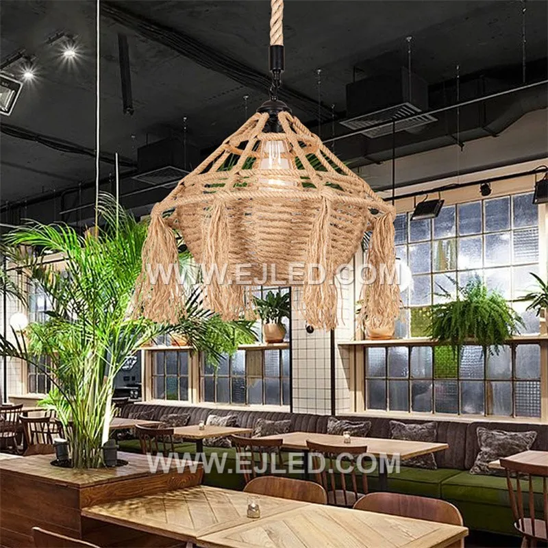 The RP0085 is a distinctive bowl-shaped pendant light, intricately woven from natural rattan with a decorative tassel fringe. Its recessed single lamp provides a soft, focused downlight, enhancing intimate dining or lounge areas. - view 4