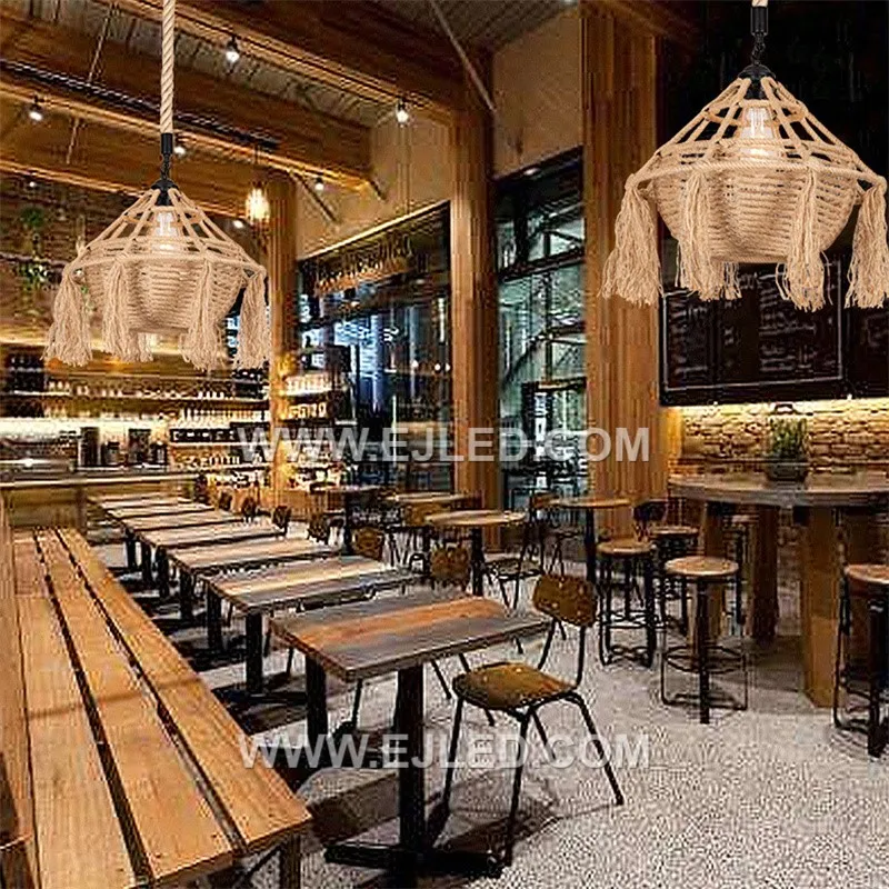 The RP0085 is a distinctive bowl-shaped pendant light, intricately woven from natural rattan with a decorative tassel fringe. Its recessed single lamp provides a soft, focused downlight, enhancing intimate dining or lounge areas. - view 5