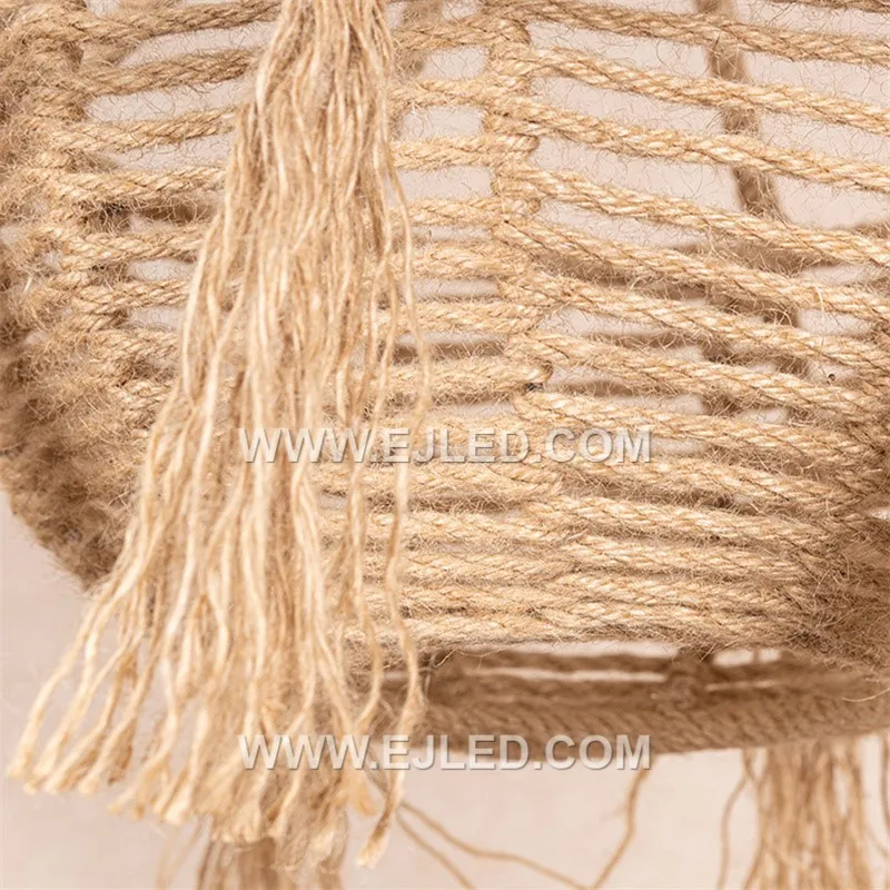 The RP0085 is a distinctive bowl-shaped pendant light, intricately woven from natural rattan with a decorative tassel fringe. Its recessed single lamp provides a soft, focused downlight, enhancing intimate dining or lounge areas. - view 6