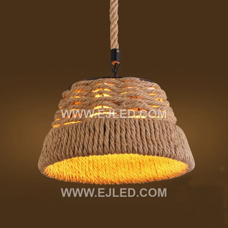 The RP0097 bell pendant, woven from natural rattan with a moderately open structure, offers diffused downward light that minimizes direct glare. Its classic shape and textured material create a warm ambiance while illuminating surfaces below. - view 2