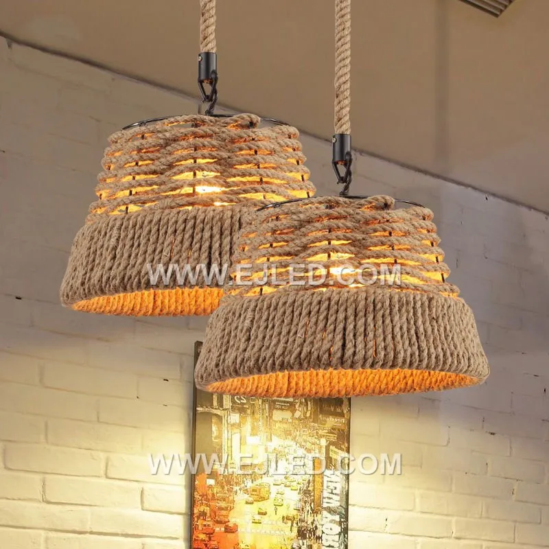The RP0097 bell pendant, woven from natural rattan with a moderately open structure, offers diffused downward light that minimizes direct glare. Its classic shape and textured material create a warm ambiance while illuminating surfaces below. - view 3