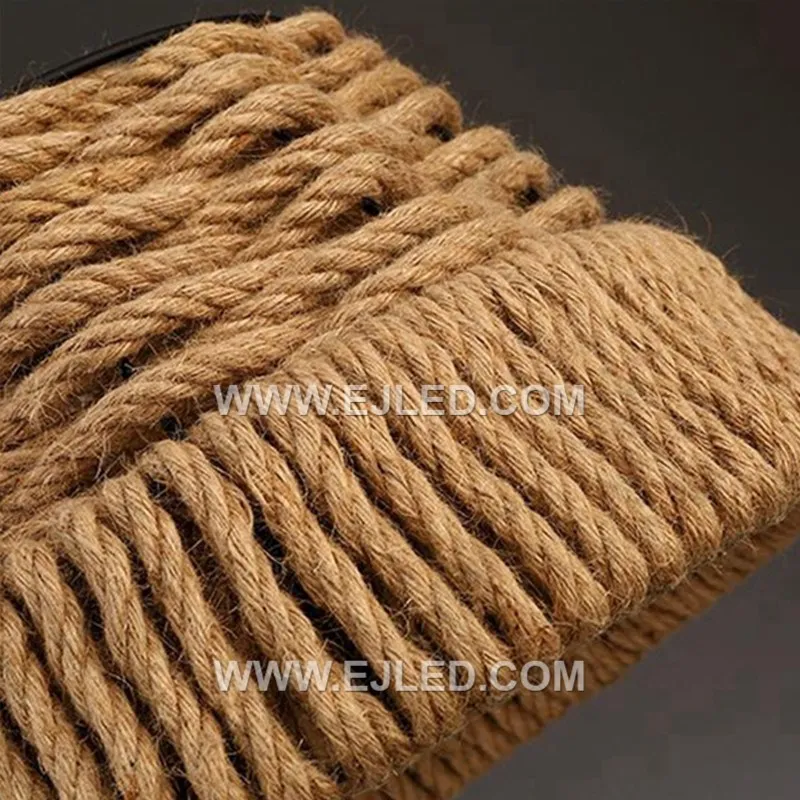 The RP0097 bell pendant, woven from natural rattan with a moderately open structure, offers diffused downward light that minimizes direct glare. Its classic shape and textured material create a warm ambiance while illuminating surfaces below. - view 5