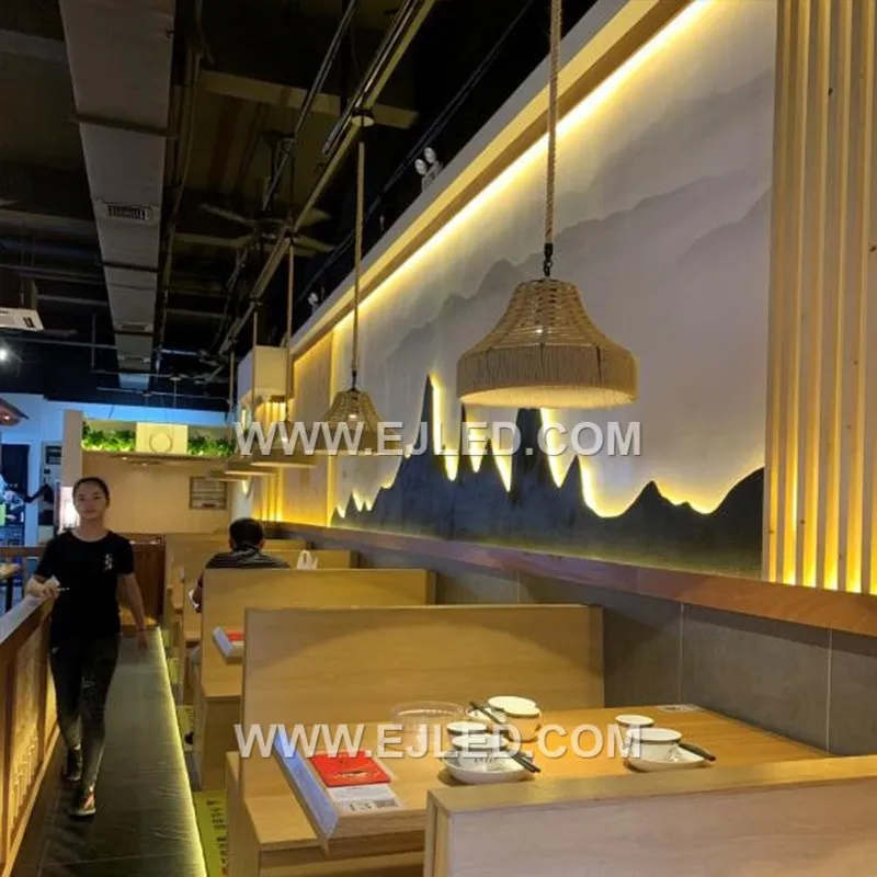 The RP0099 pendant offers a broad, shallow profile, making it suitable for rooms with lower ceilings or over wide surfaces like dining tables and kitchen islands. Its open, hand-woven shade projects diffuse ambient light downwards. - view 5