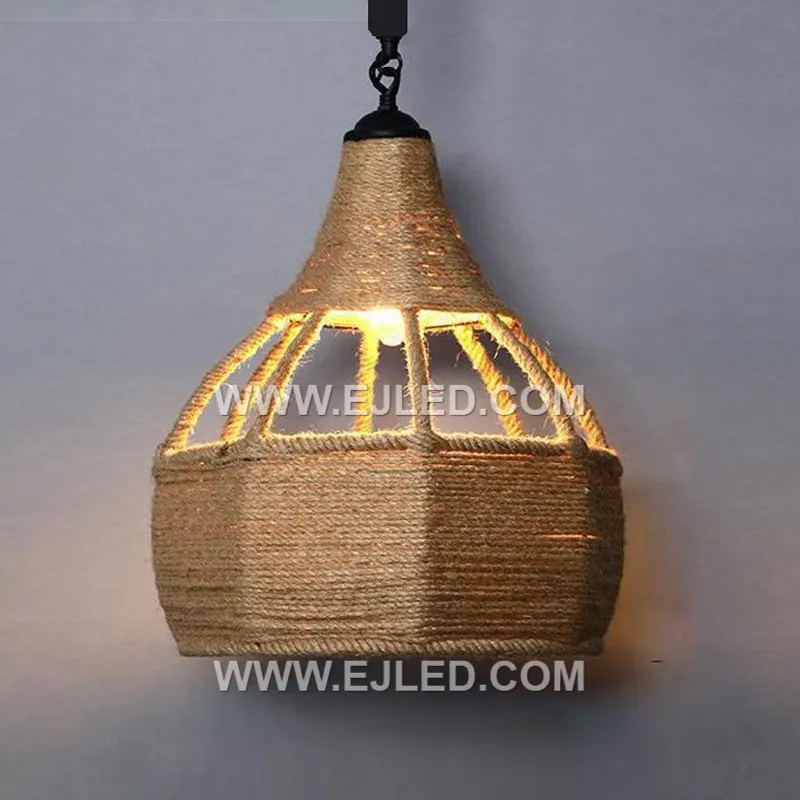 Natural rattan is hand-woven into an open, shallow bowl shape, allowing the light source to remain visible. This RP0101 pendant light offers a broad spread of ambient light suitable for various interior settings. - view 3
