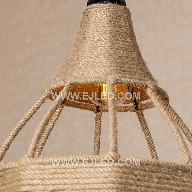 Natural rattan is hand-woven into an open, shallow bowl shape, allowing the light source to remain visible. This RP0101 pendant light offers a broad spread of ambient light suitable for various interior settings. - view 4