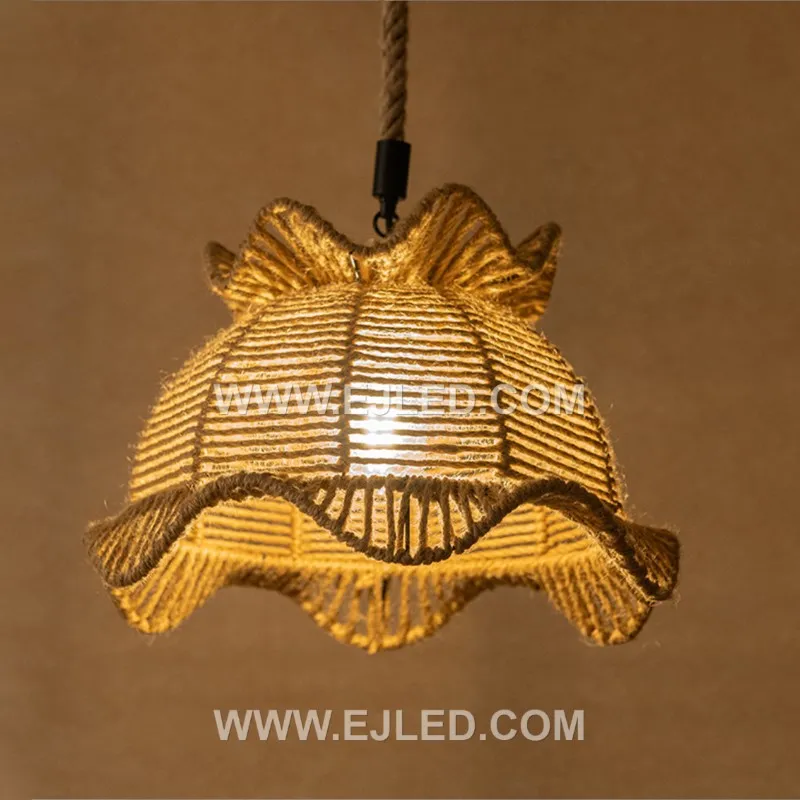 This bell-shaped rattan pendant, the RP0104, features an open, hand-woven texture that permits light to diffuse in all directions. It offers a warm, inviting glow, making it suitable for ambient illumination in various spaces. - view 4