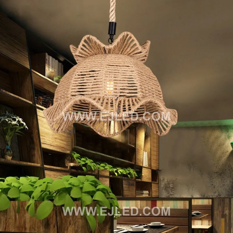 This bell-shaped rattan pendant, the RP0104, features an open, hand-woven texture that permits light to diffuse in all directions. It offers a warm, inviting glow, making it suitable for ambient illumination in various spaces. - view 5