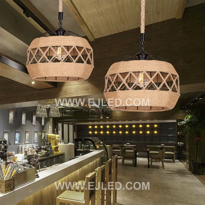 This RP0114 drum pendant distinguishes itself with an elongated, horizontal shape, handcrafted from rustic iron and natural rope to enclose a single lamp for focused light over long surfaces. - view 3