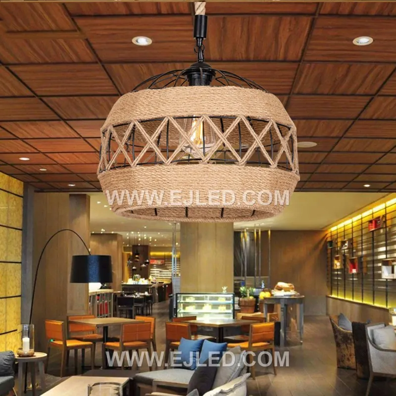 This RP0114 drum pendant distinguishes itself with an elongated, horizontal shape, handcrafted from rustic iron and natural rope to enclose a single lamp for focused light over long surfaces. - view 5