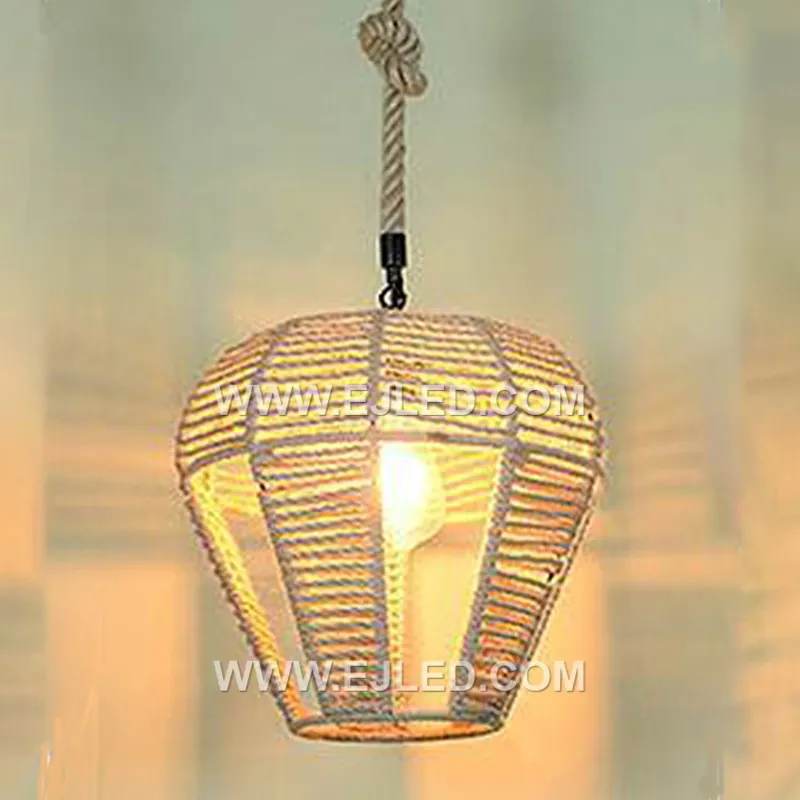 A bell-shaped pendant light, the RP0115 is woven from rattan, forming a shade that directs light downwards. Its design minimizes glare while providing a focused illumination, suitable for tasks or creating defined zones. - view 3