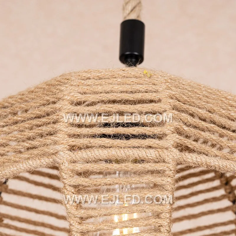 A bell-shaped pendant light, the RP0115 is woven from rattan, forming a shade that directs light downwards. Its design minimizes glare while providing a focused illumination, suitable for tasks or creating defined zones. - view 5