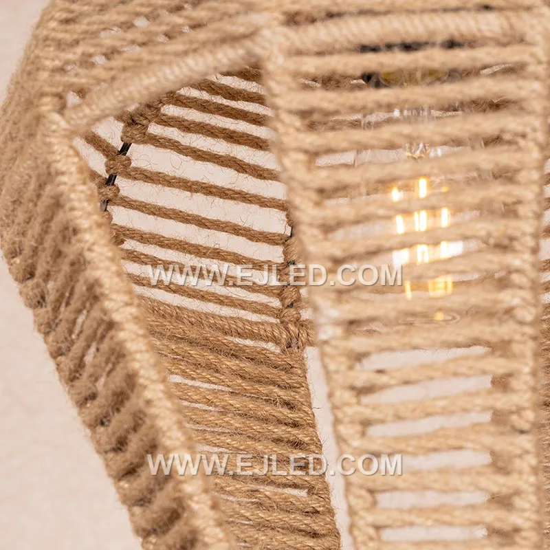 A bell-shaped pendant light, the RP0115 is woven from rattan, forming a shade that directs light downwards. Its design minimizes glare while providing a focused illumination, suitable for tasks or creating defined zones. - view 6