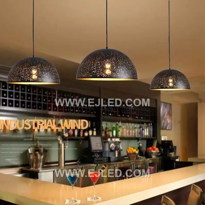 Crafted from durable iron, the MK0046 is a dome pendant with a dark finish. Its distinctive perforated shade creates a "starry sky" effect, casting a decorative pattern of light. - view 2