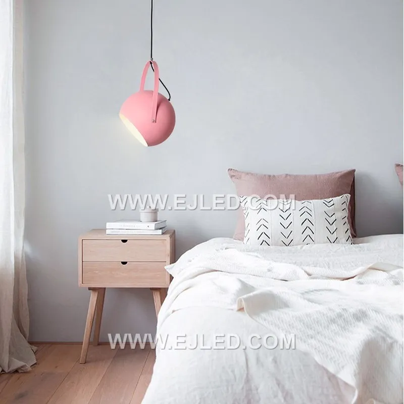 The MK0094 is a black steel barn pendant featuring a wide, round shade and a distinctive decorative band around its upper perimeter. It directs a focused downlight, suitable for rustic or industrial settings. - view 2