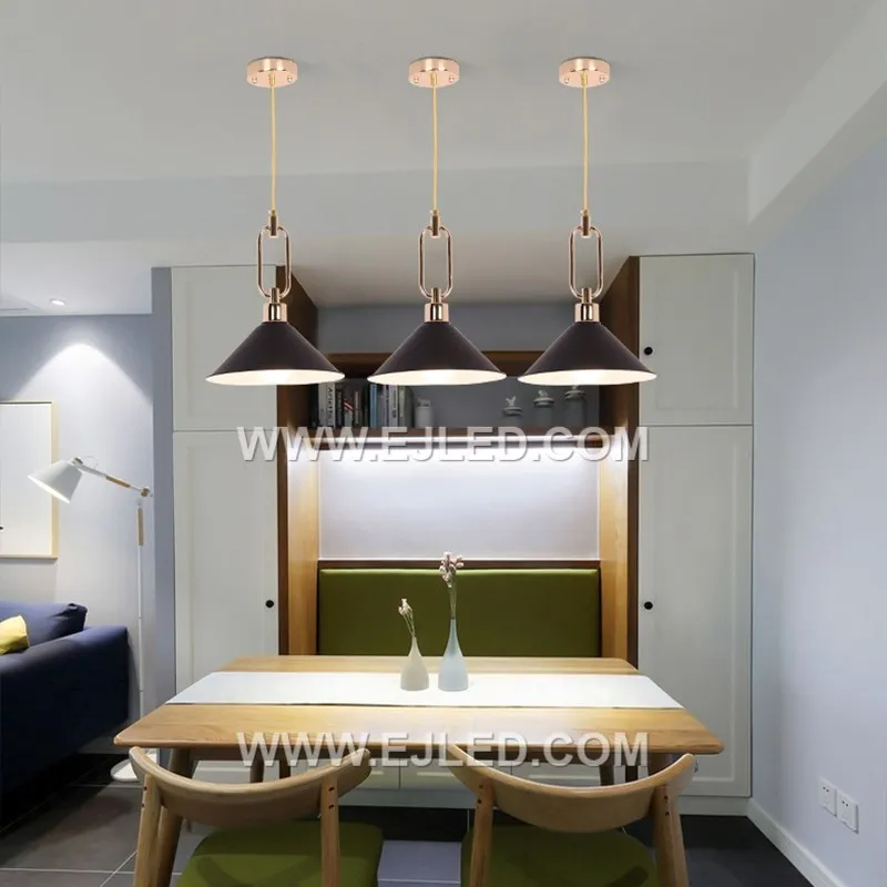The MK0113 is a deep, conical pendant light constructed from aluminum with a matte black exterior and reflective interior. Its focused downlight makes it suitable for individual task areas or as a clustered arrangement in larger spaces. - view 5