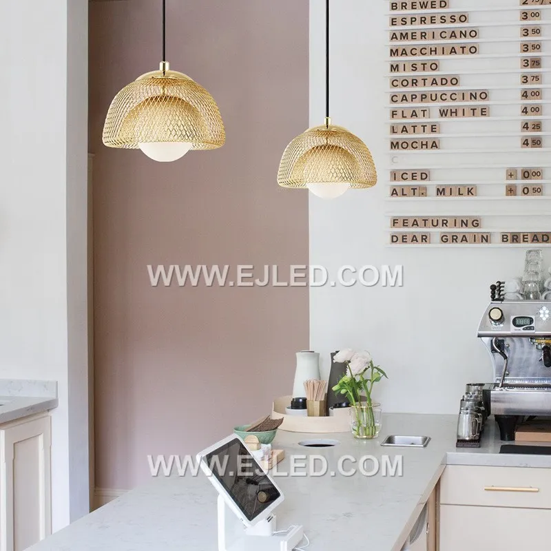 A distinctive dome silhouette defines the MK0117 pendant, formed by an open cage of slender brass rods, finished in a subtle golden hue. Its airy design allows for widespread ambient light, making it a distinctive focal point in modern or rustic interiors. - view 4