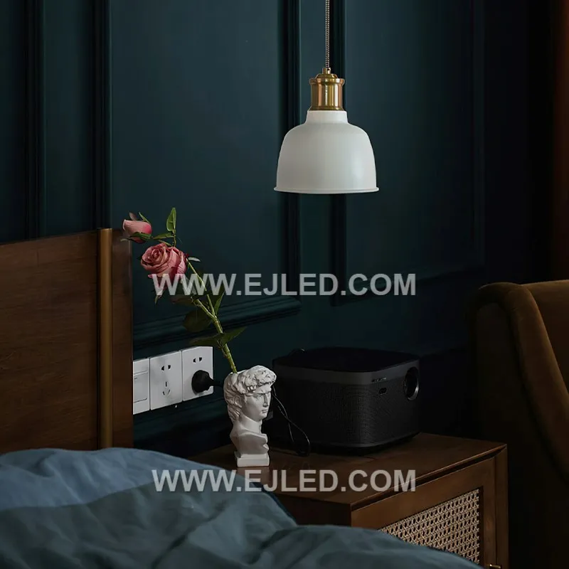 A brass dome pendant, the MK0143 features a unique textured gold finish that adds visual depth. The metal's reflectivity casts a warm, inviting glow, making it suitable for dining areas or hospitality settings. - view 3