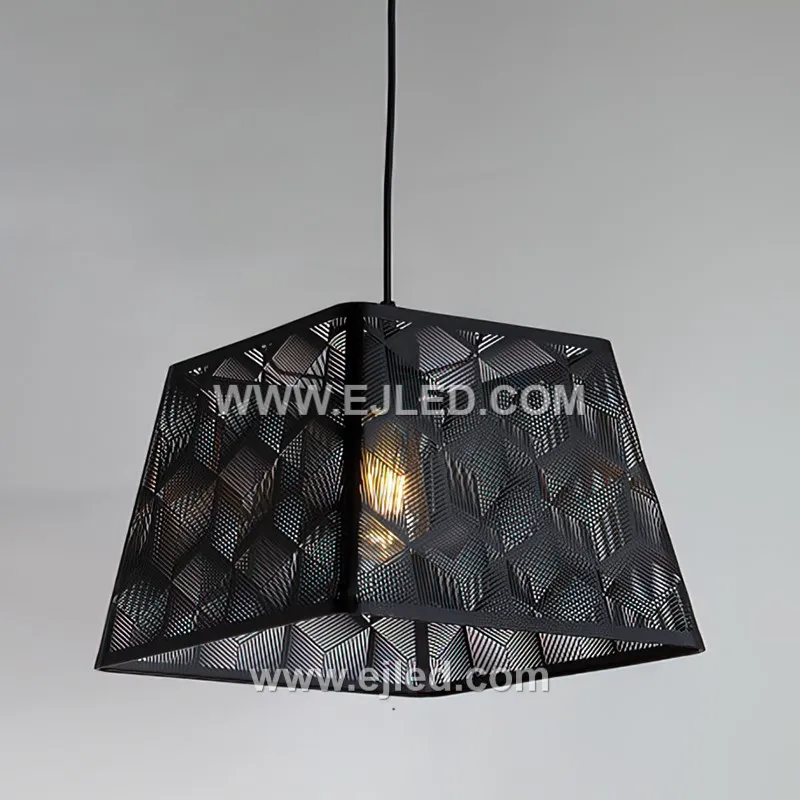This black iron pendant features a cylindrical shade with an intricate laser-cut pattern, casting decorative light effects. Open at the bottom, it provides both ambient glow and direct downlight for intimate spaces.