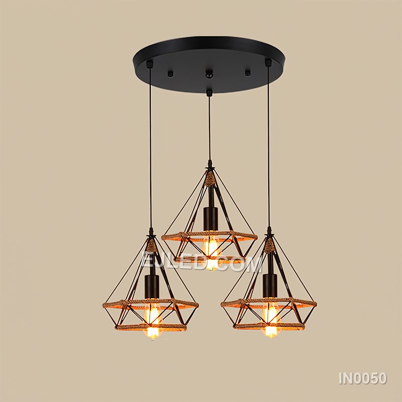 The black-finished brass construction of the IN0050 pyramid pendant light supports an exposed bulb within its open cage. A decorative hemp rope detail completes this single fixture, ideal for specific design schemes. - view 3