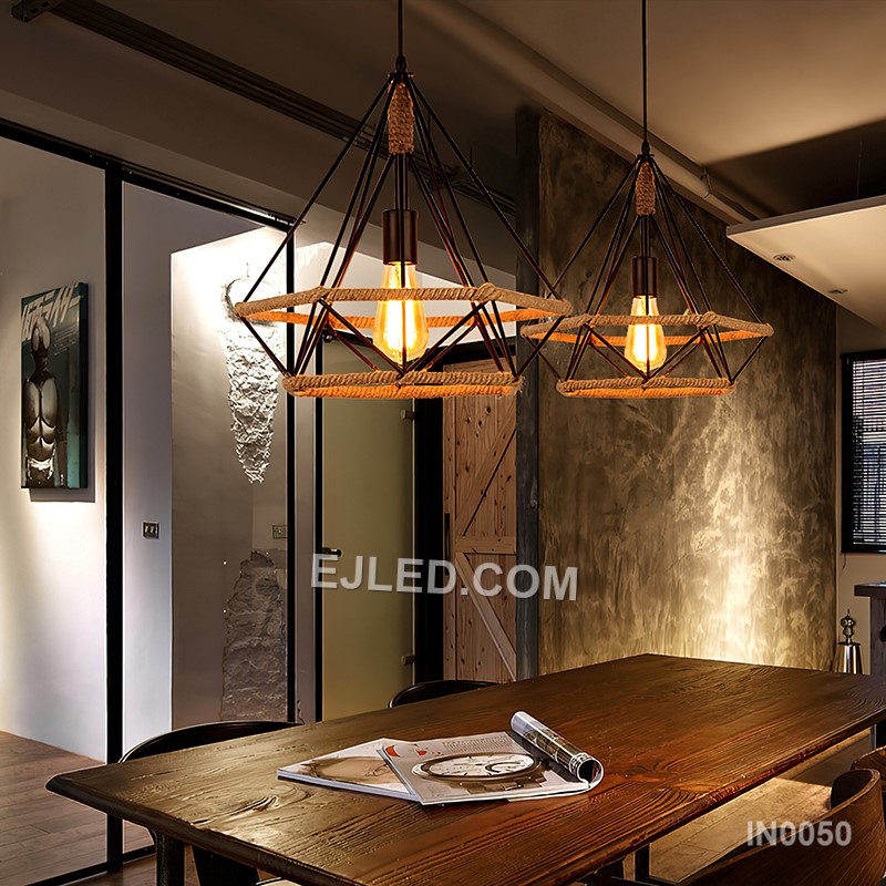 The black-finished brass construction of the IN0050 pyramid pendant light supports an exposed bulb within its open cage. A decorative hemp rope detail completes this single fixture, ideal for specific design schemes. - view 5