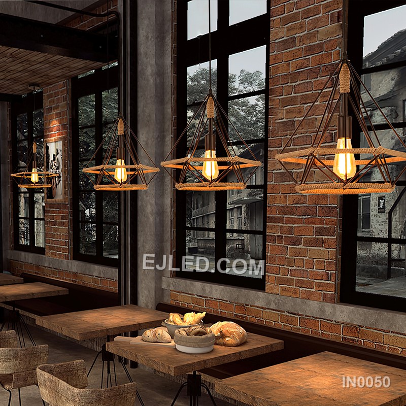 The black-finished brass construction of the IN0050 pyramid pendant light supports an exposed bulb within its open cage. A decorative hemp rope detail completes this single fixture, ideal for specific design schemes. - view 6