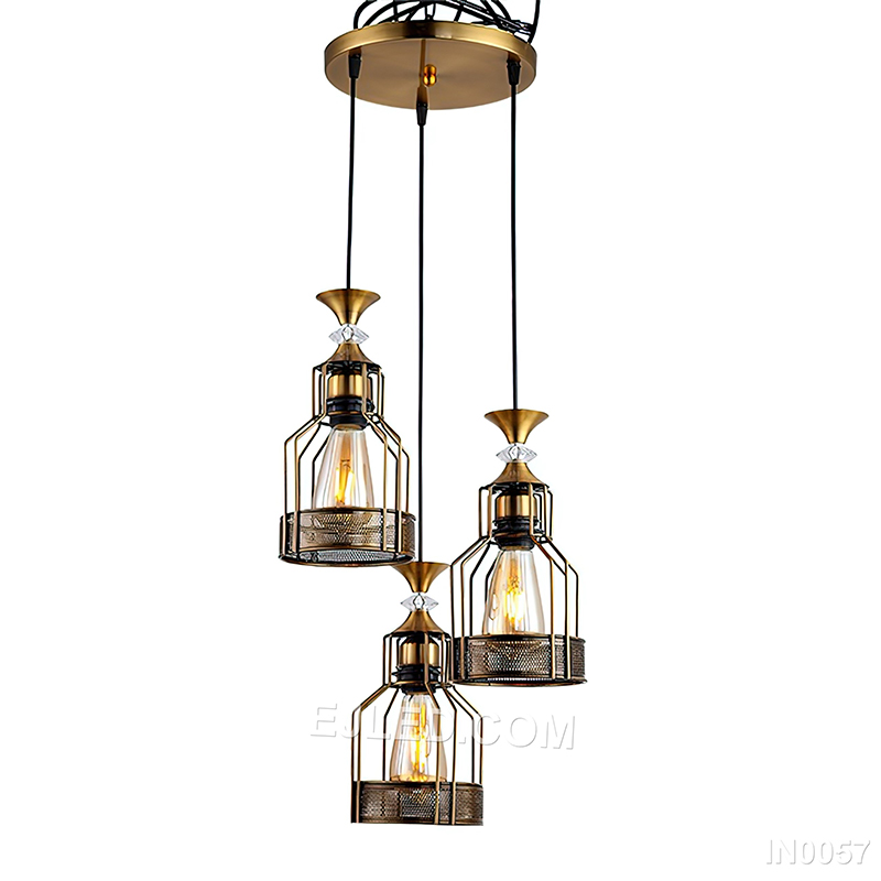 Round silhouettes define this three-light cluster pendant, where each brass-toned cage frames a clear glass globe, directing focused light downwards for general or task illumination.