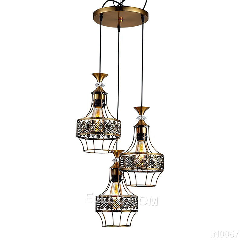 Round silhouettes define this three-light cluster pendant, where each brass-toned cage frames a clear glass globe, directing focused light downwards for general or task illumination. - view 3