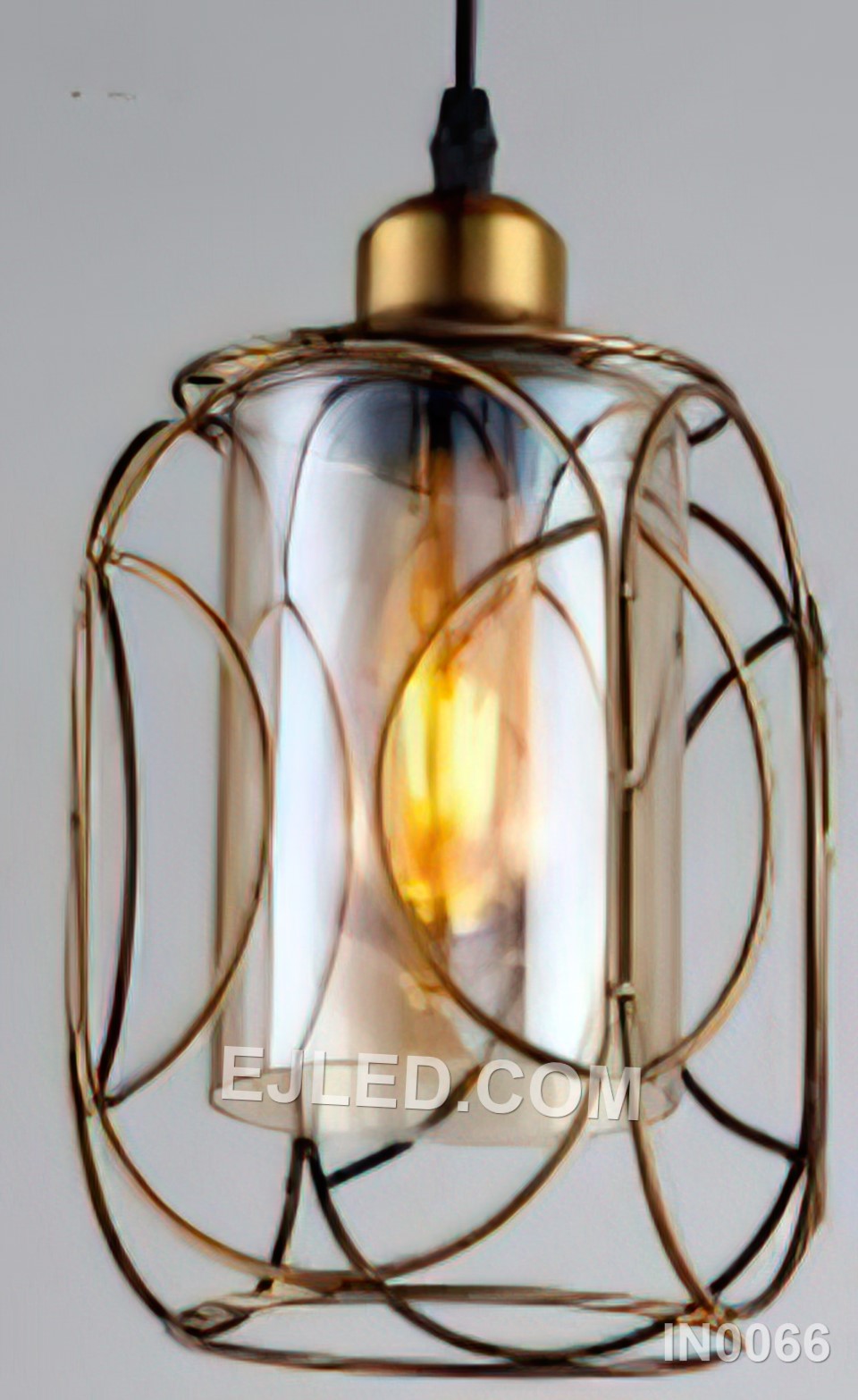 This slender gold-finished brass pendant light, featuring a clear cylindrical glass shade and a single lamp, adds a bright focus above kitchen islands, bars, or in compact settings where height is a feature.