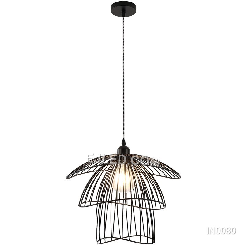Layered black iron petals form the distinctive shade of the IN0080 Iron Pendant Light, encircling a single lamp. This open, sculptural design casts diffuse light and creates unique shadow patterns.