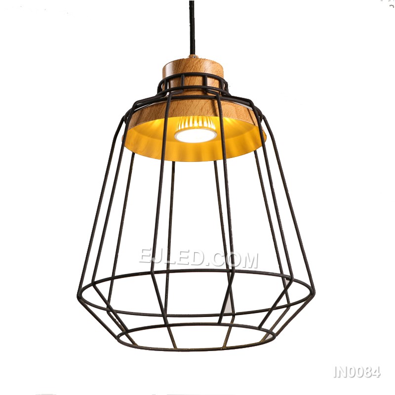 A cylindrical "birdcage" form defines the IN0084 pendant light, crafted from black metal wire and accented with natural wooden discs at the top and bottom. This open design offers ambient light with minimal obstruction.