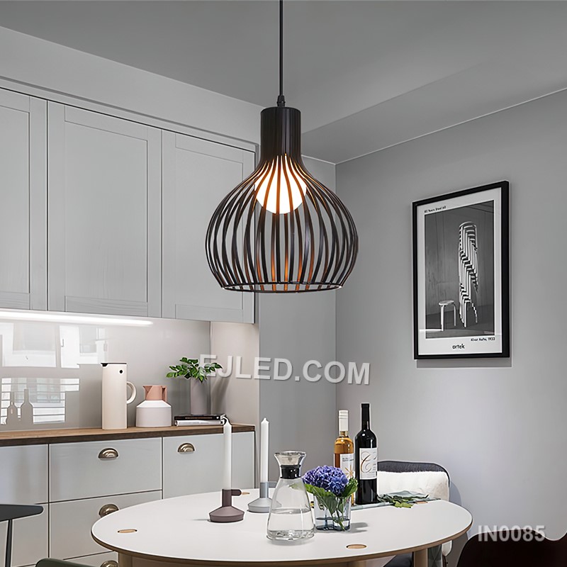 A round, open wire cage defines this single black iron pendant light, designed to cast a soft, ambient glow suitable for dining areas, bar counters, or hotel lobbies. Its simple form allows for versatile placement. - view 6