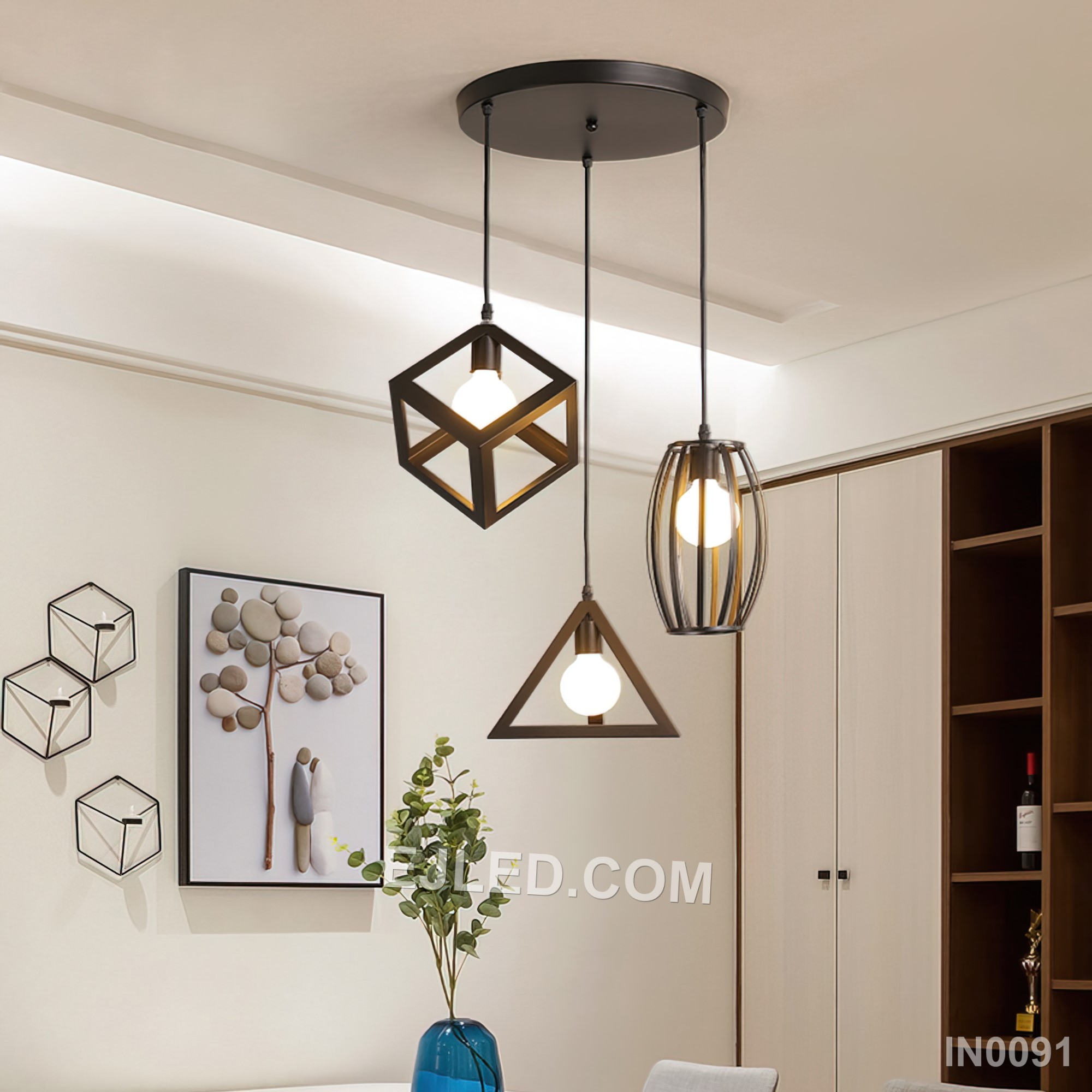 Three open cylindrical black iron cages create a staggered cluster pendant light, each enclosing a single bulb. This fixture provides diffused ambient light and a distinctive visual element for various interiors. - view 5